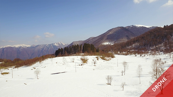 Aerial View of Snowy Mountains in a Sunny Day