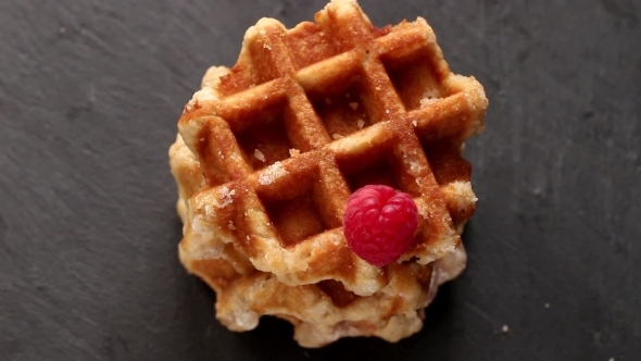 Belgian Waffles With Raspberries And Sugar Powder Over Rusty Surface