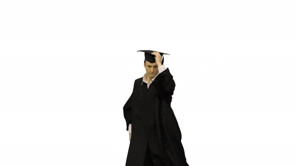 Male Graduate in Robe and Mortarboard Doing Modern Dance with Arms in the Air Looking at Camera on