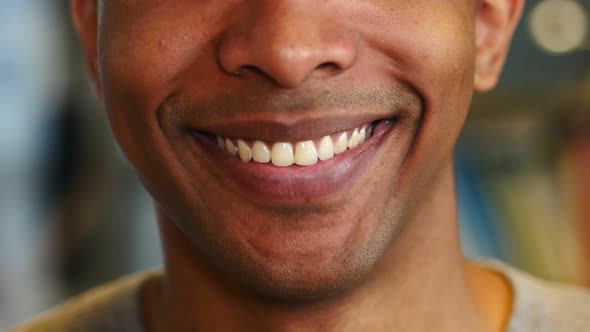 Close Up of Smiling Lips and Teeth of African Man