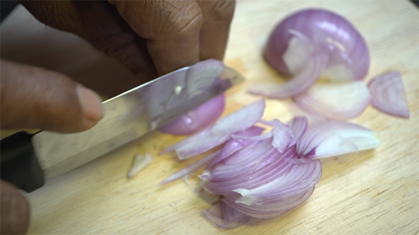 Asian Chopping a Red Onion