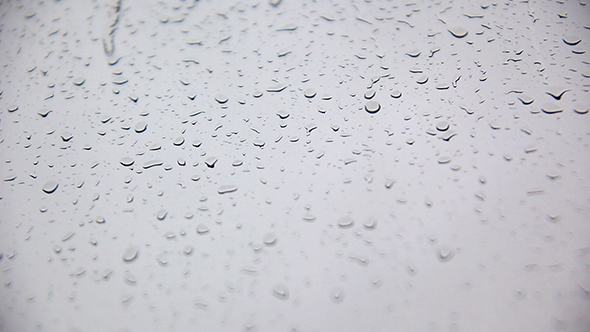 Rain Drops Fall On The Glass