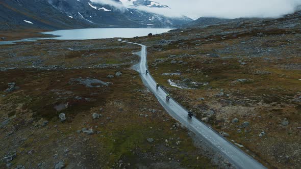 Scenic Drone Shot of Cyclists on Mountain Road