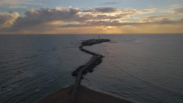 Aerial View of the Beautiful Lighthouse and the Sunset on the Horizon