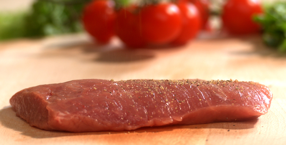 Adding Pepper on Meat