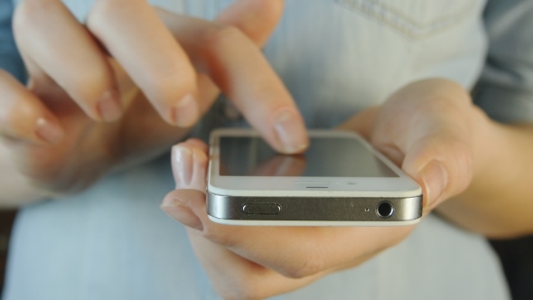 Young Woman Using Mobile Phone - Smartphone  alt