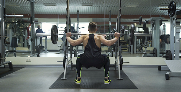 Athlete Performs Wide Stance Barbell Squats 2