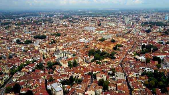 City of Padua Italy with tiled red roofs and Basilica of St. Anthony, Aerial dolly out reveal shot