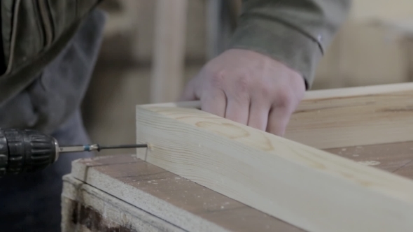Worker Making Furniture. Drill alt