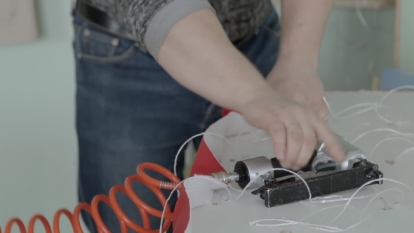 Worker Making Furniture. Stapler. Hauling Furniture alt