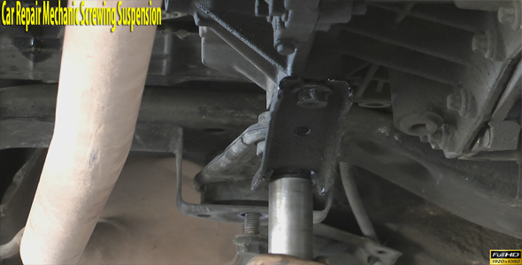 Car Repair Mechanic Screwing Suspension