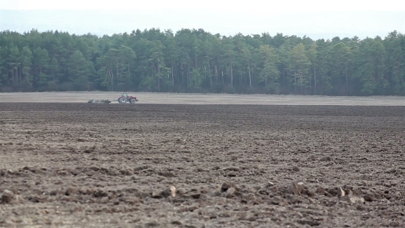 Tractor Plowing The Field