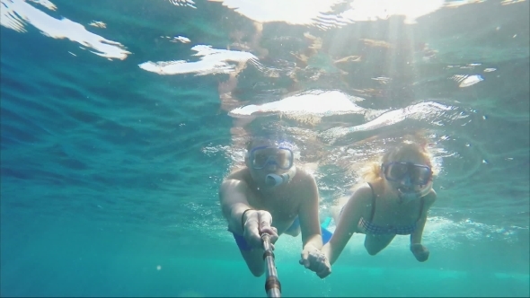 Couple Swimmers Doing Selfie Using Sticks Under Water
