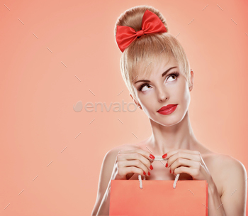  shopping bag. Confidence sensual attractive pretty nude blonde sexy girl, Pinup hairstyle, red bow. Unusual playful. Romantic on pink, sale, discount