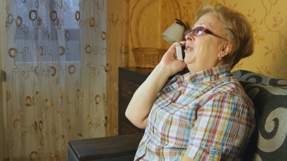 Mature Woman Talking On Cell Phone 