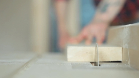 Circular Saw Cuts Wooden Boards And Chips Flying In All Directions