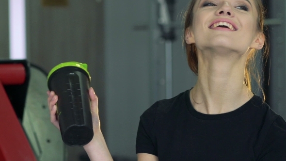 Beautiful Girl With a Shaker In The Gym