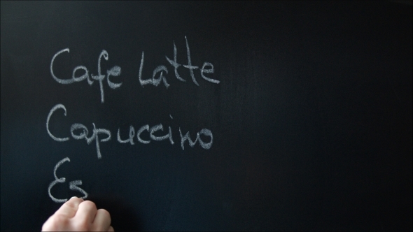 Writing Coffee-Shop Menu On The Chalkboard