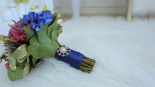 Bride Bouquet Of Blue Flowers Tied With Satin Ribbon