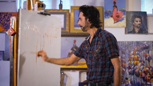 Artist Start Painting On The Canvas Which Lay On The  Tripod Paint. alt