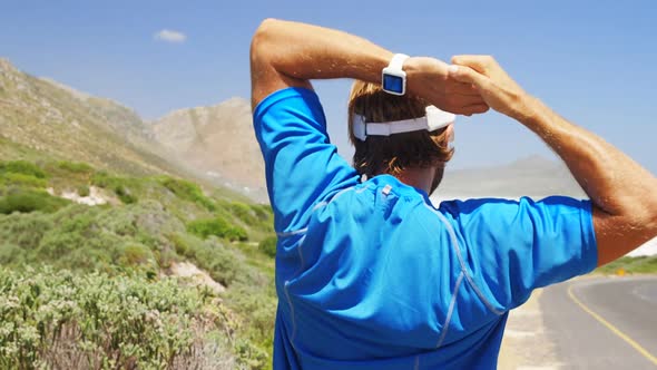 Rear view of triathlete man exercising on a sunny day