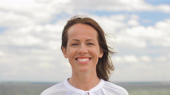 Portrait of Happy Smiling Woman at Summer Beach