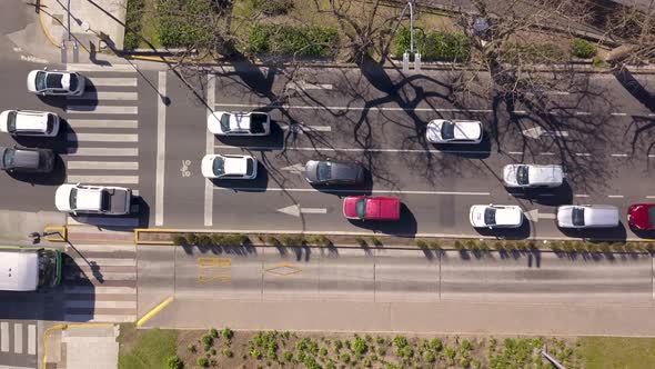 Aerial top down of cars and buses driving on separate lanes, Buenos Aires Metrobus