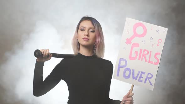 Young Female Feminist with Megaphone Promoting Feminism
