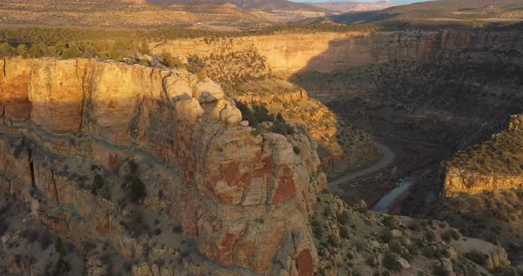 Moving shot of drone video over butte at sunset in Colorado.