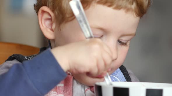 Little Boy Eating A Soup Itself 