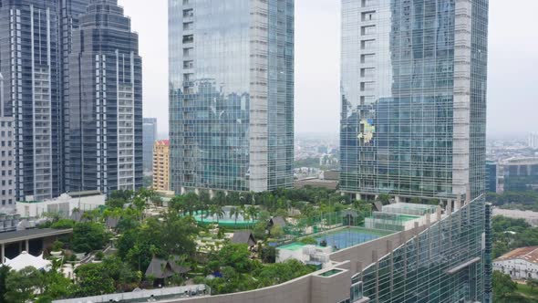 Rooftop Garden Between Skyscraper Buildings. Revealing Drone Shot. Jakarta - Indonesia