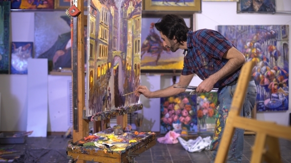 Senior Man Painting On a Canvas