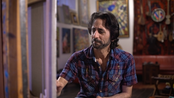 Work On The Result. Artist Process Of Painting a Picture  alt