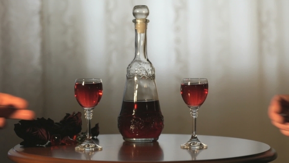 Young Couple Hands Holding Glasses With Tincture