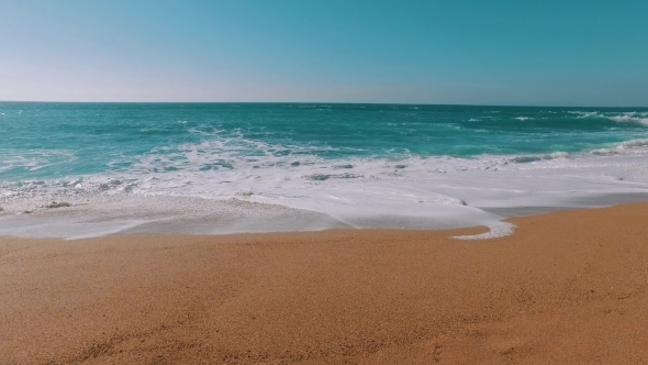 Ocean Waves Incoming On Sand Beach