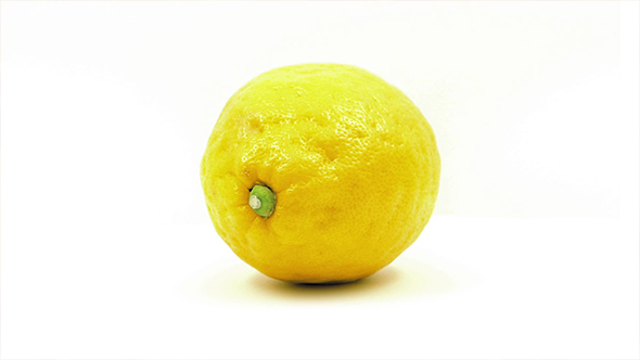 Lemon Rotates On Plain Background