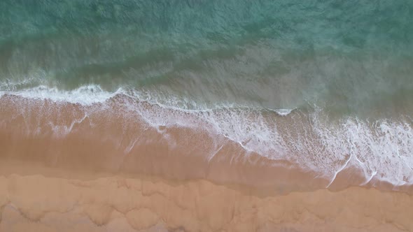 Sea summer Beautiful waves Foaming and Splashing on the beach sand. Ocean sea. Beautiful waves