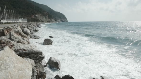 Waves Crash Onto the Breakwater in Marina