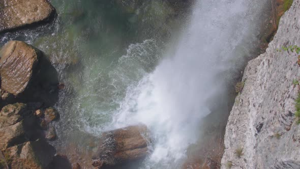 Waterfall crashing into the river