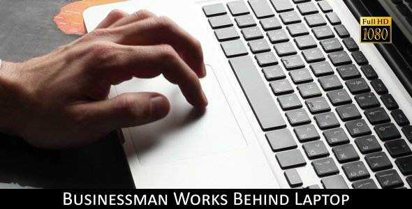 Businessman Works Behind Laptop 4 alt
