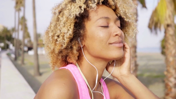 Young Woman Grinning With Pleasure