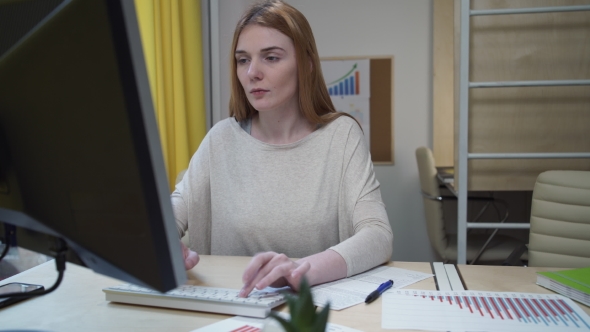 Girl Typing On The Keyboard