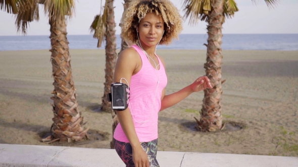 Confident Fit Woman With Arm Band Music Player