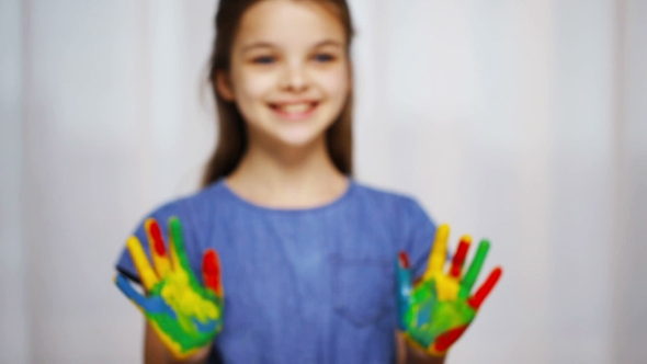 Smiling Girl Showing Painted Hands