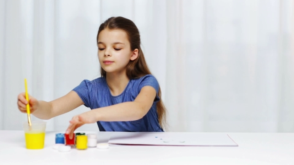 Happy Girl Painting With Gouache Colour At Home