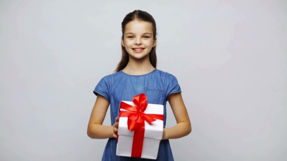Happy Smiling Girl Holding Gift Box