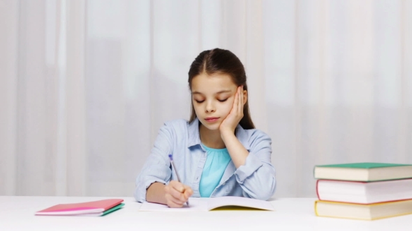 Bored School Girl With Books And Notepad At Home