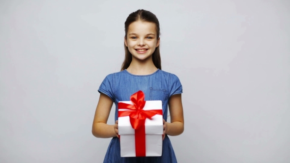 Happy Smiling Girl Holding Gift Box