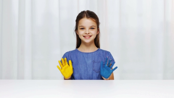 Smiling Girl Showing Painted Hands