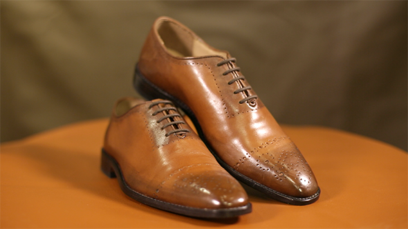 3 Pairs of Brown Leather Shoes on Display